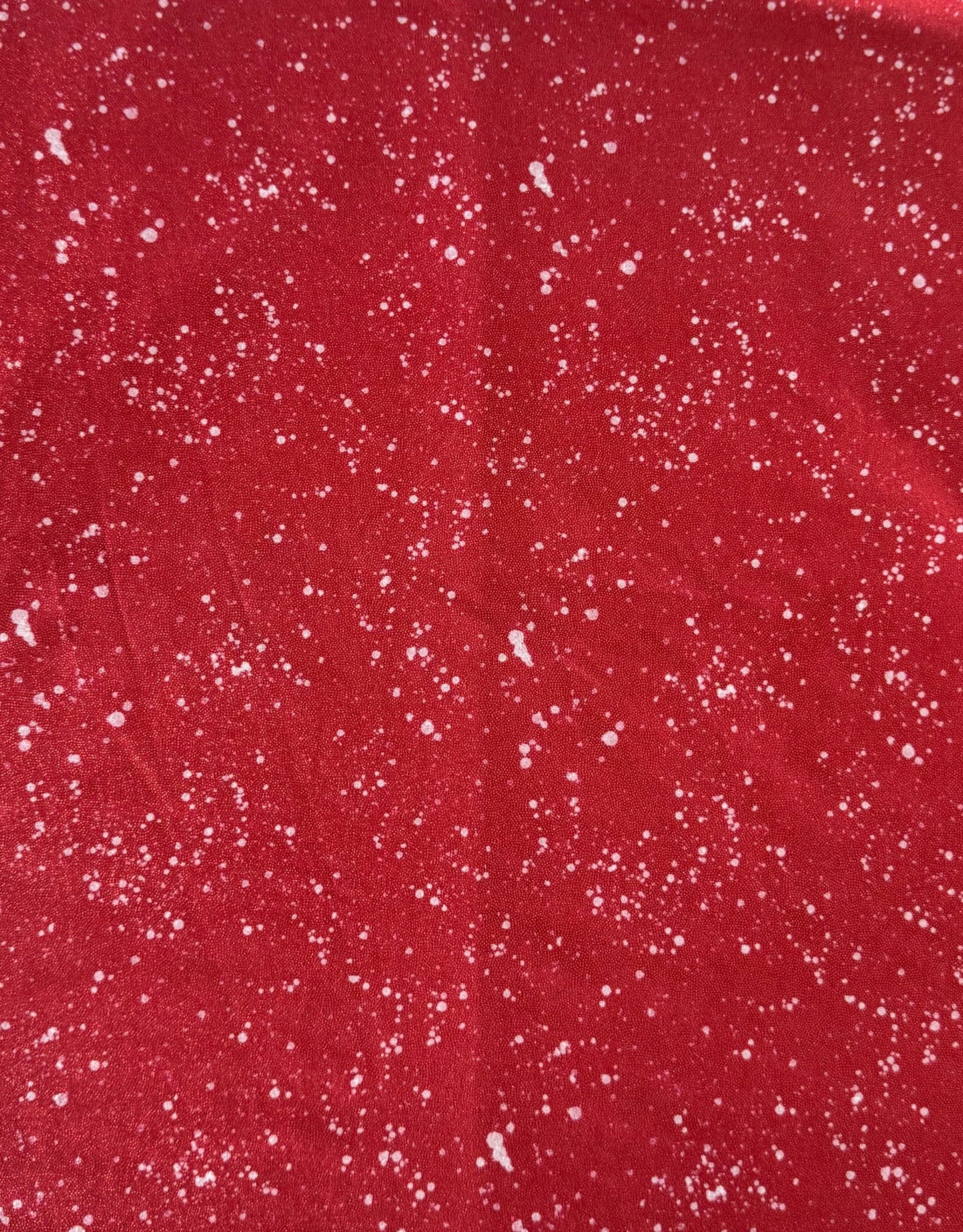 Red fabric with white speckles