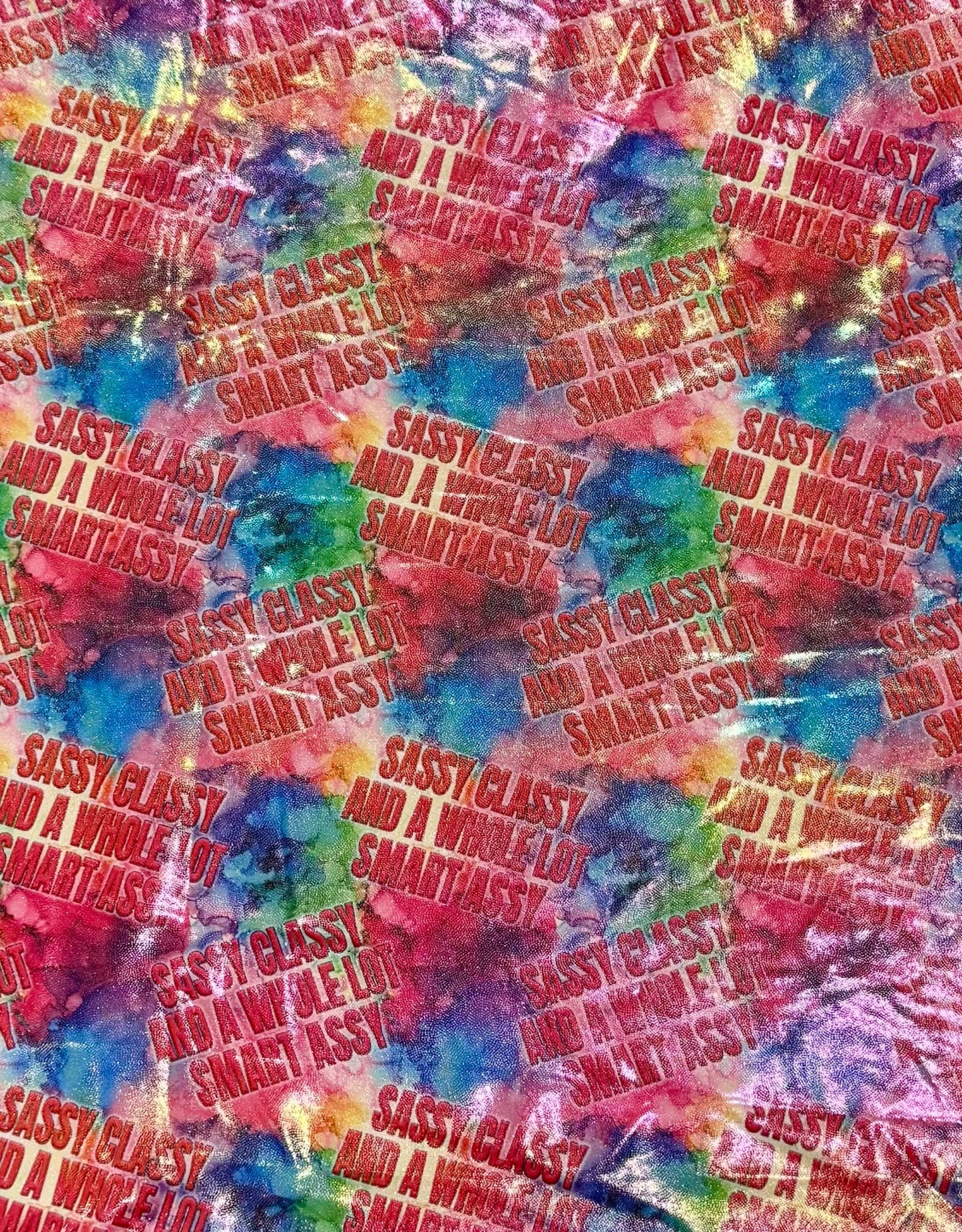 Colorful tie-dye pattern with text overlay on a multicolored background