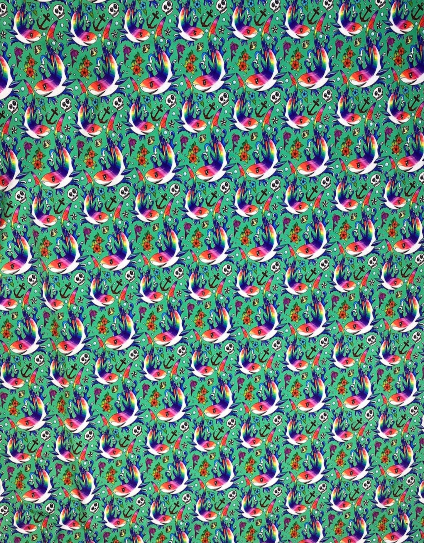 Colorful pattern of birds and flowers on a green background
