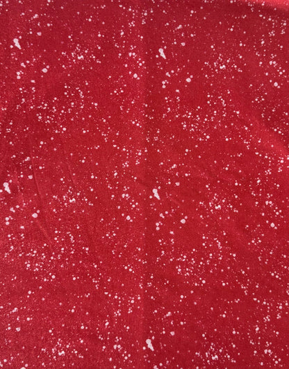 Red fabric with white speckles