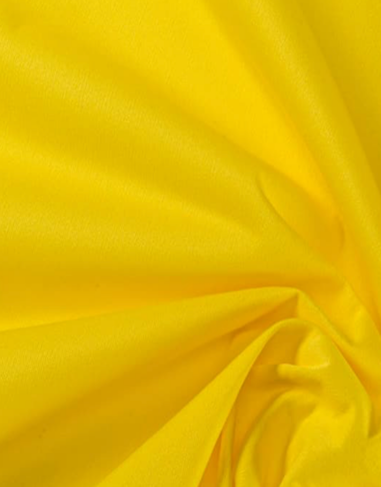 Close-up of yellow fabric with folds