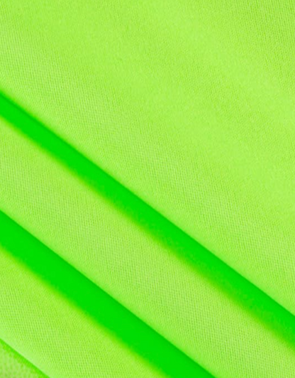 Close-up of bright green fabric with a diagonal fold