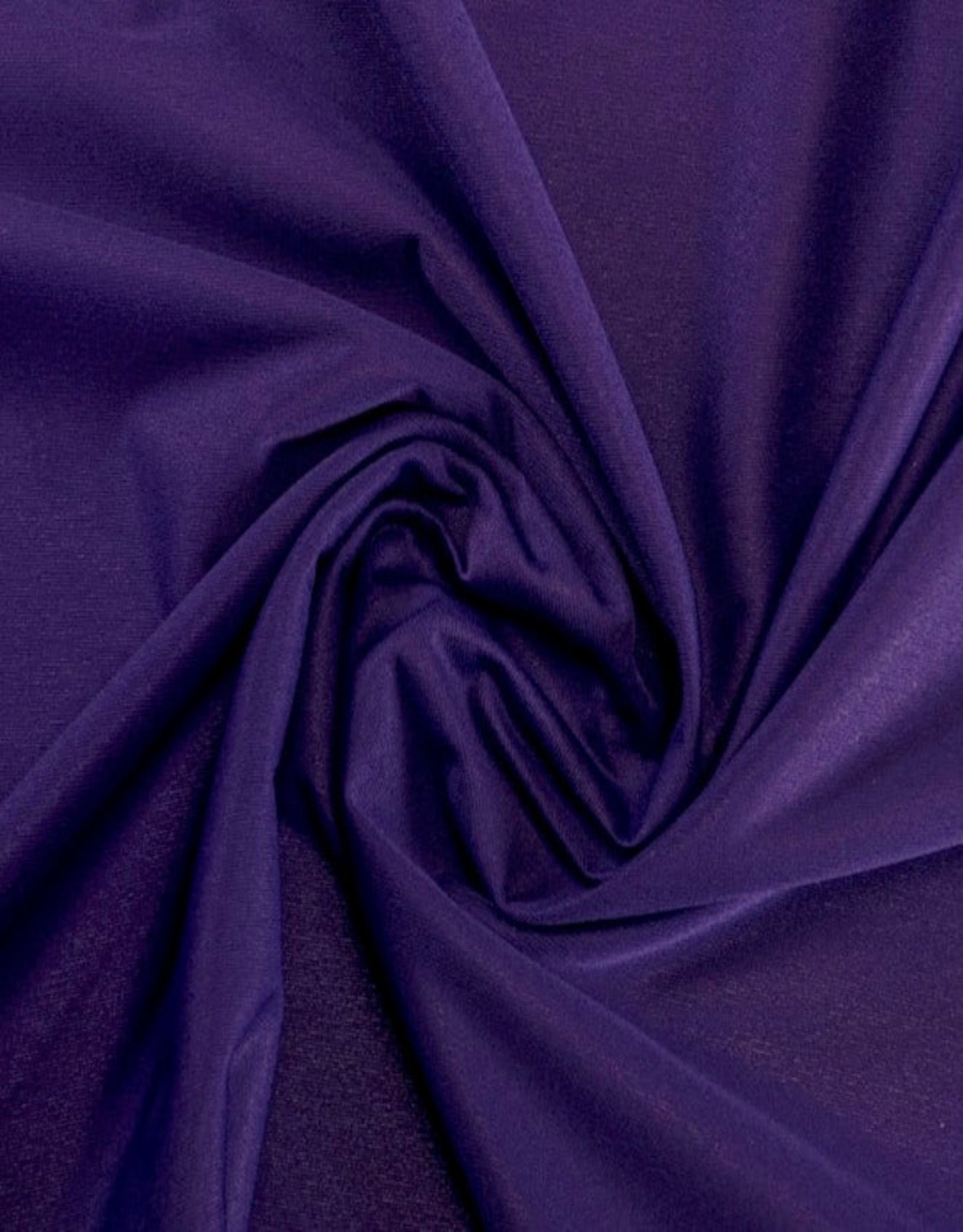 Close-up of purple fabric with folds