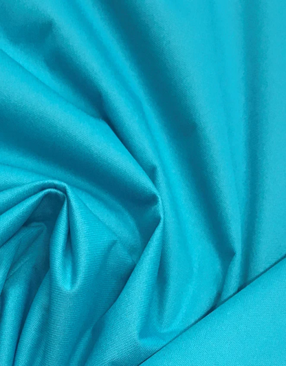 Close-up of teal fabric with folds